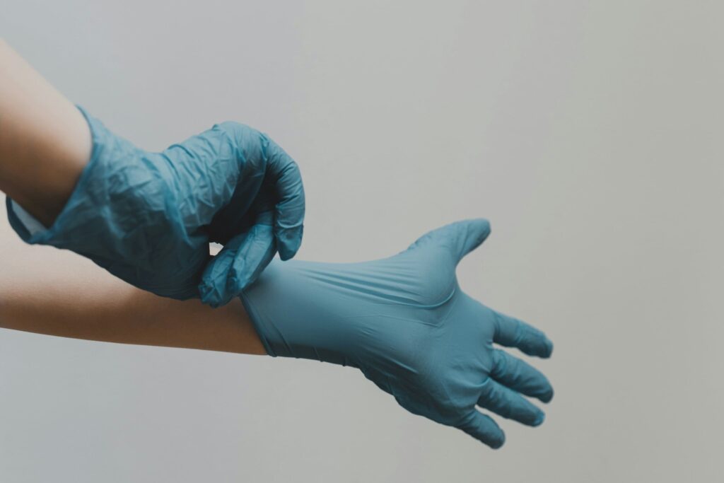 a person with gloves for cleaning